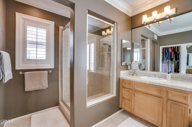 bathroom featuring ornamental molding, an enclosed shower, tile patterned floors, and vanity