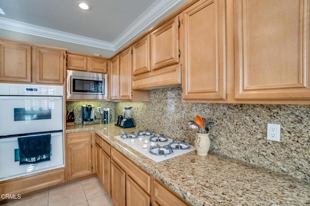 kitchen with white appliances, decorative backsplash, ornamental molding, light tile patterned flooring, and light stone counters