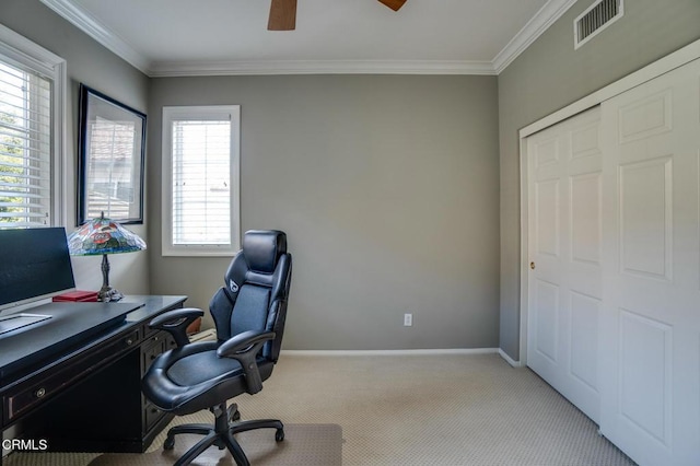 office space featuring ornamental molding, ceiling fan, and light colored carpet