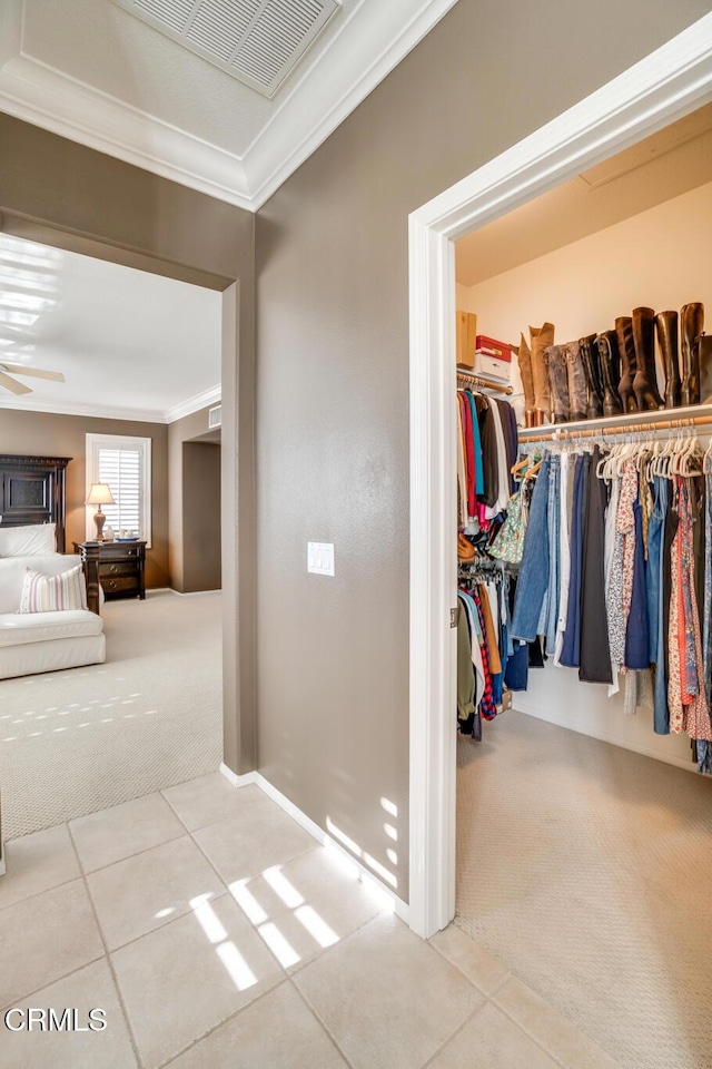 interior space with light colored carpet and crown molding