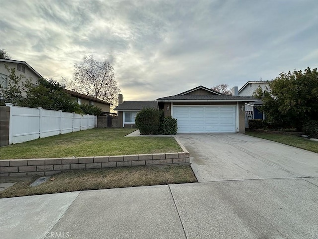 view of front of house featuring a garage and a front yard