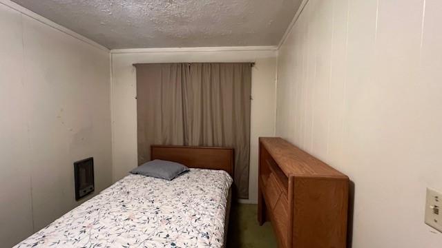 bedroom featuring a textured ceiling