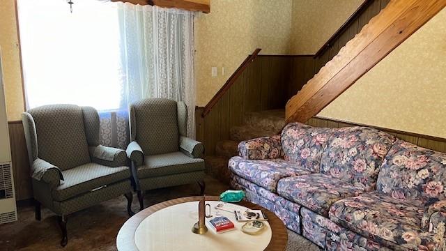 living room featuring wooden walls