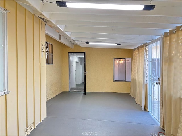 corridor featuring concrete flooring