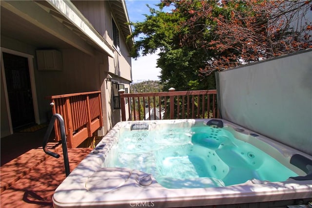 deck with a hot tub