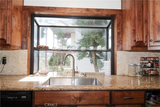 905 Madera Ln, Lake Arrowhead, CA 92352 - kitchen featuring a sink, black dishwasher, light stone counters, and decorative backsplash