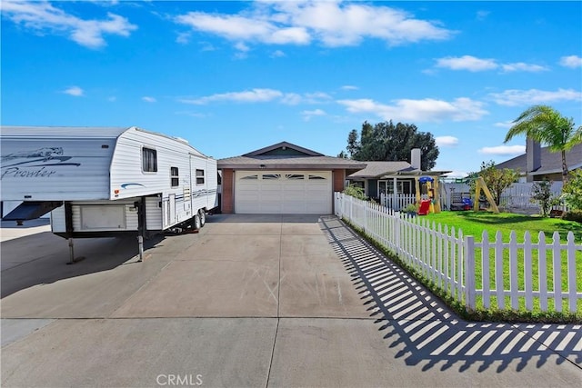 view of front facade with a garage and a front yard