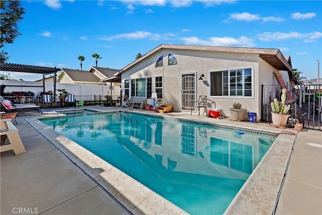 view of swimming pool featuring a pergola and a patio area