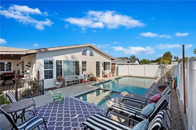 view of swimming pool featuring a patio area