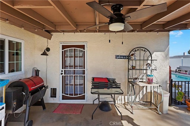 view of patio featuring grilling area and ceiling fan