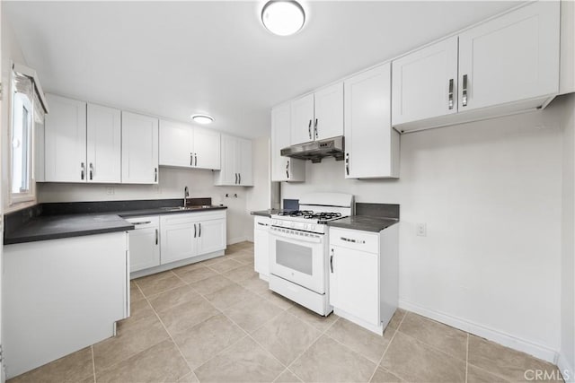 kitchen featuring light tile patterned floors, sink, white gas range, and white cabinetry