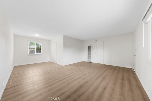 empty room featuring light wood-type flooring