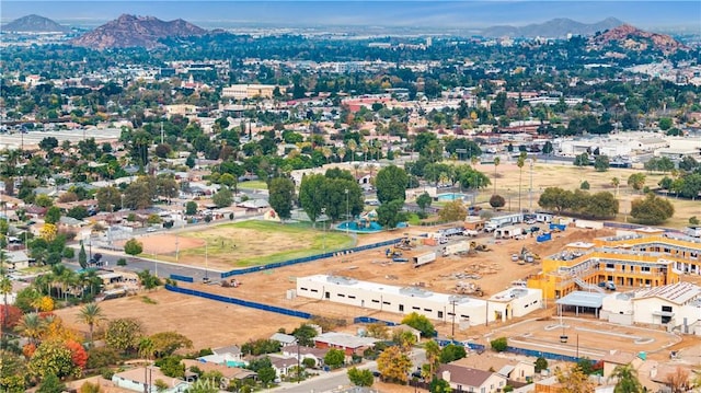 birds eye view of property featuring a mountain view