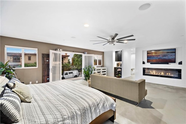 bedroom featuring ceiling fan and access to outside