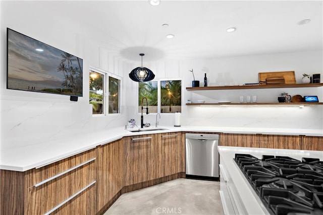 kitchen with stainless steel dishwasher, hanging light fixtures, and sink