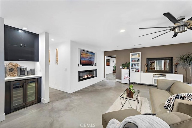 living room featuring ceiling fan and beverage cooler