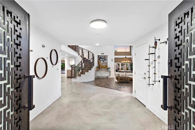 entrance foyer featuring concrete flooring