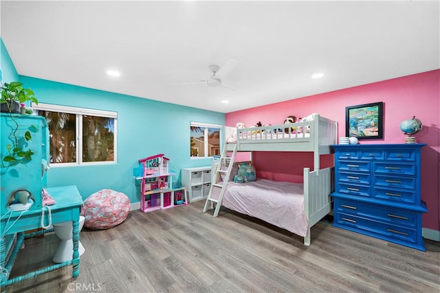 bedroom with ceiling fan and hardwood / wood-style flooring