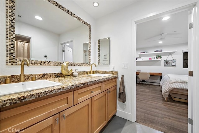 bathroom featuring hardwood / wood-style floors and vanity