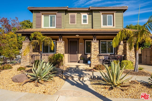 view of front of property featuring covered porch