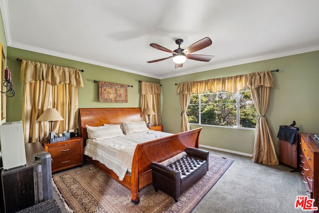 carpeted bedroom with ceiling fan and crown molding