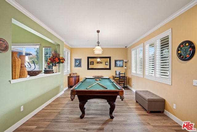 recreation room with billiards, crown molding, and hardwood / wood-style flooring