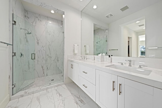 bathroom with an enclosed shower and vanity