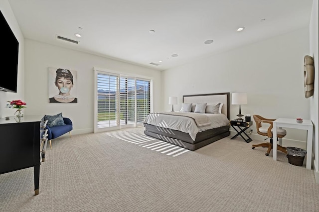 bedroom with access to exterior and light colored carpet