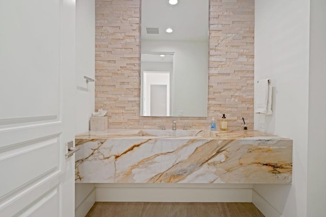 bathroom with tasteful backsplash