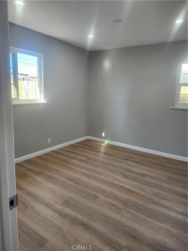 empty room featuring dark hardwood / wood-style floors