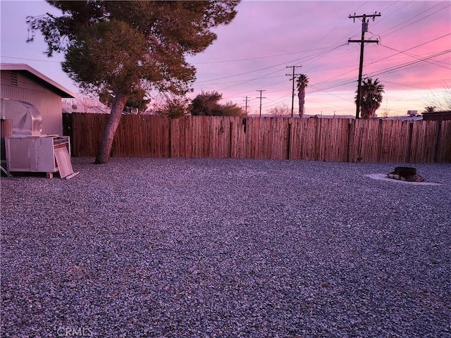 view of yard at dusk