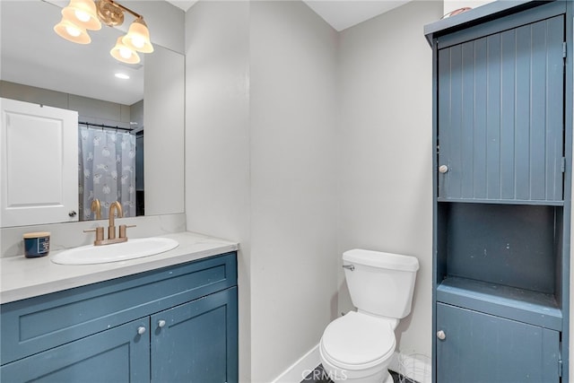 bathroom with toilet and vanity