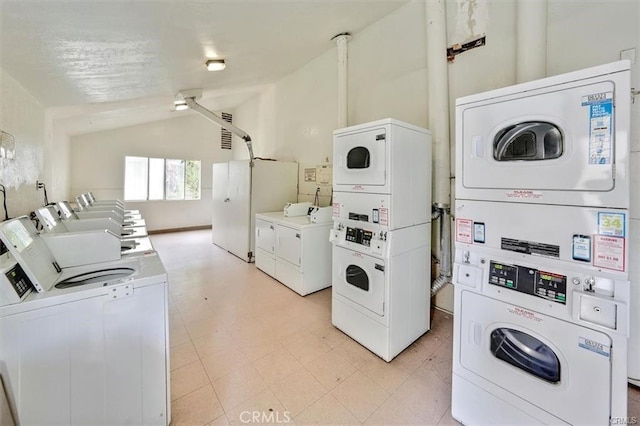 laundry area featuring stacked washer and dryer, separate washer and dryer, and ceiling fan