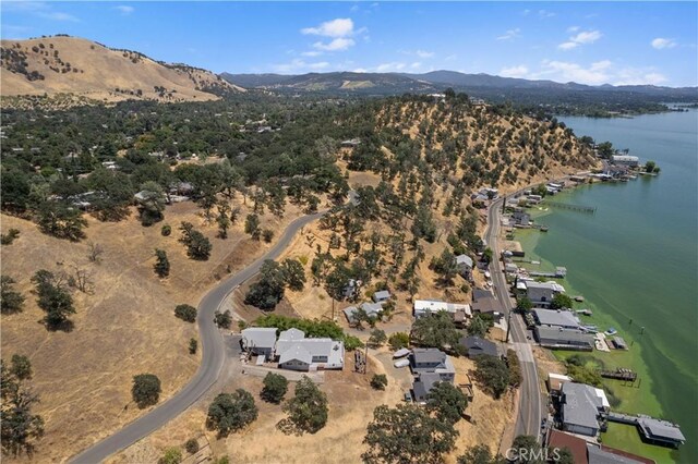 birds eye view of property featuring a water and mountain view