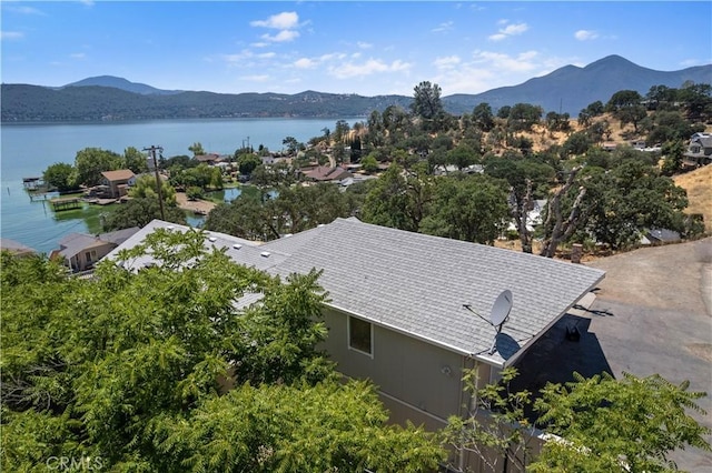 aerial view featuring a water and mountain view