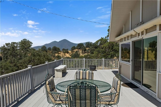 wooden deck featuring a mountain view