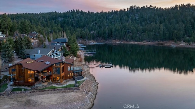 aerial view at dusk with a water view