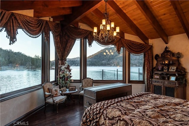 bedroom featuring wood ceiling, dark hardwood / wood-style floors, a notable chandelier, a water view, and lofted ceiling with beams