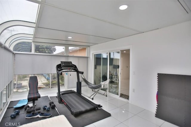 exercise room featuring light tile patterned floors