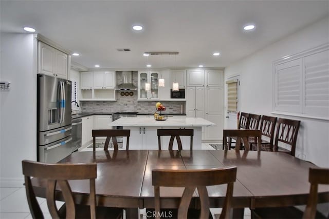 tiled dining space featuring sink