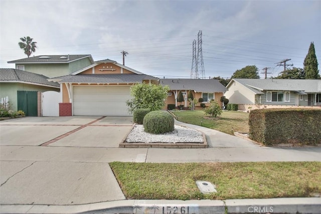 single story home with a garage and a front lawn