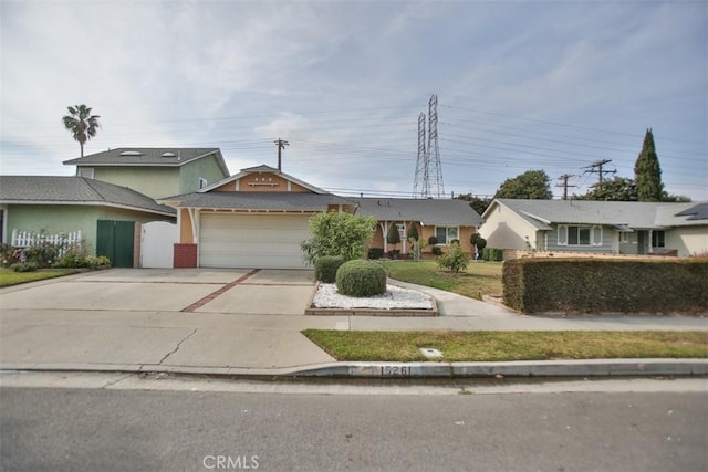 ranch-style home with a front lawn and a garage