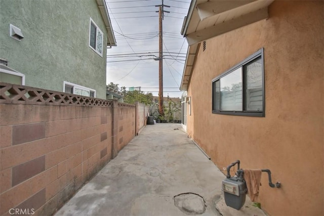 view of property exterior with a patio