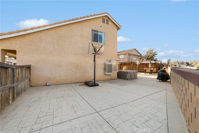 rear view of house with a patio