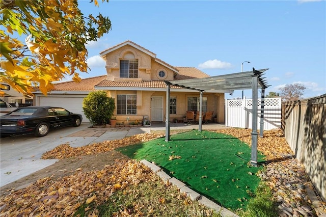 view of front of house featuring a pergola, a patio, and a garage