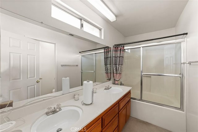 full bathroom with toilet, vanity, and shower / bath combination with glass door