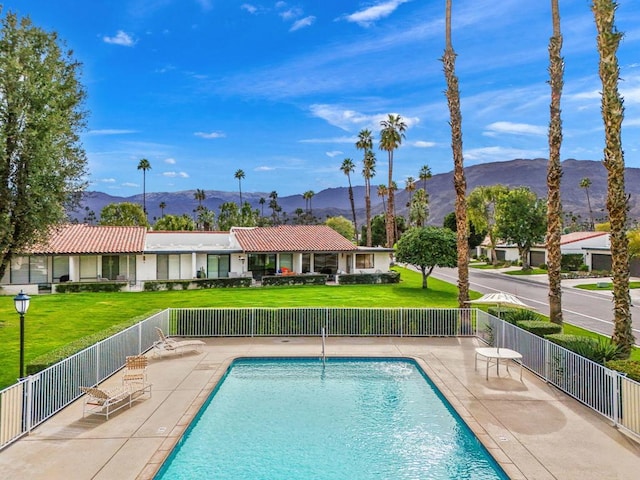 view of pool featuring a mountain view and a patio