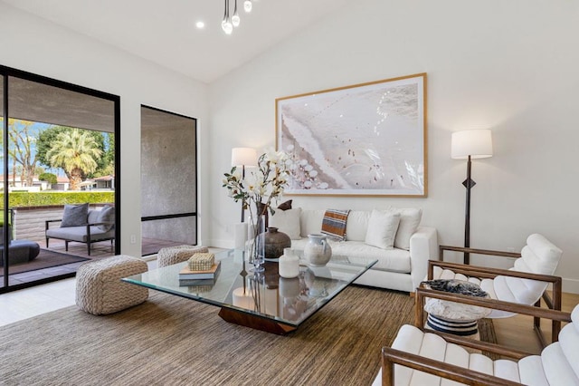 living room with vaulted ceiling and hardwood / wood-style floors