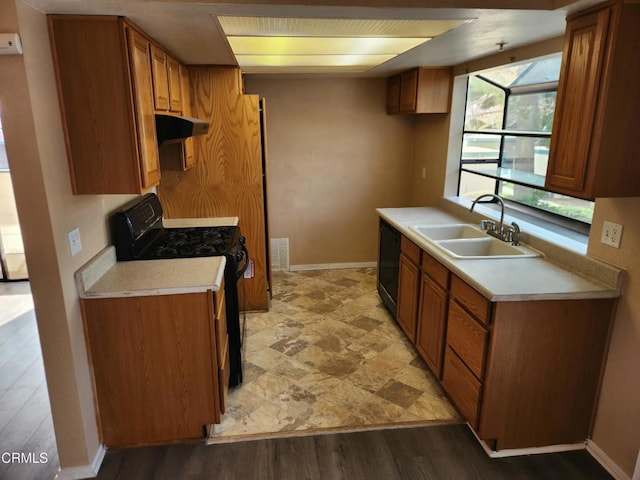 kitchen featuring black appliances and sink