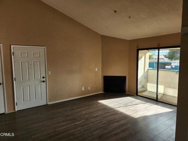 unfurnished living room featuring dark wood-type flooring